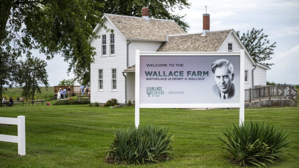 Wallace Farm Farmhouse welcome to wallace farm sign in front of farmhouse
